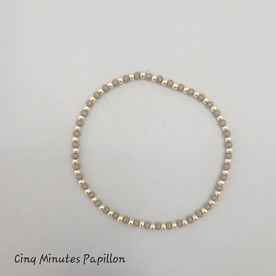 Bracelet en perles de rocaille et perles plaquées or