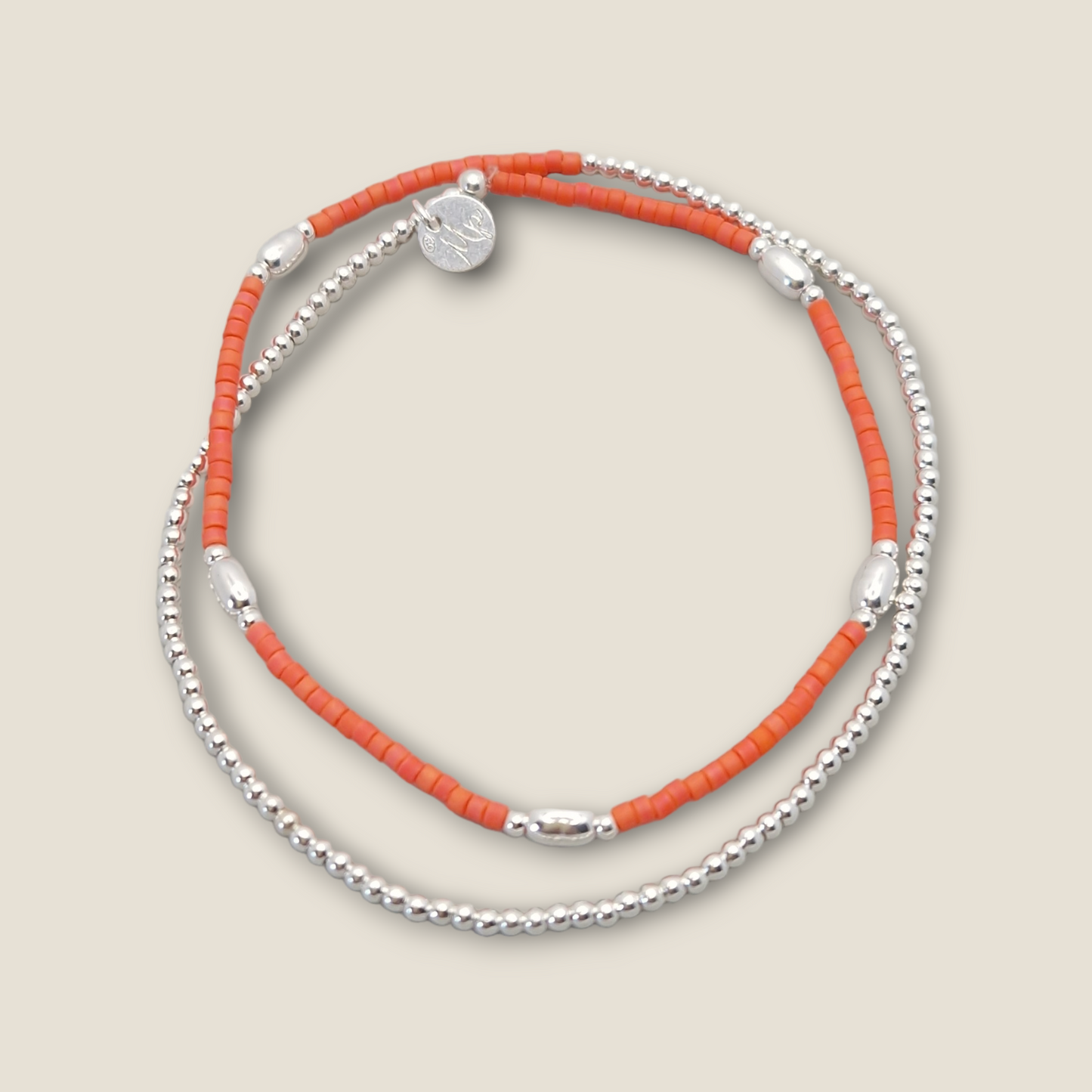 Bracelet orange et perles ovales