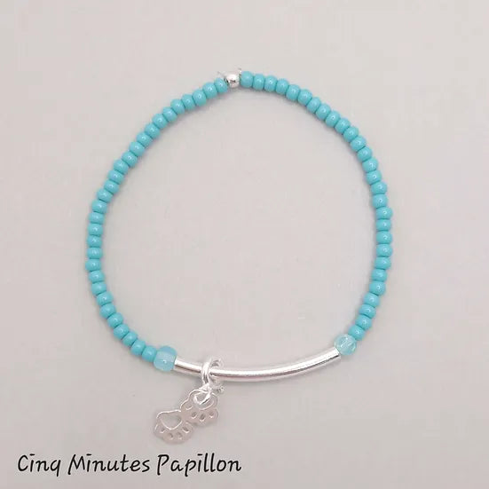 Bracelet tube en argent et breloques