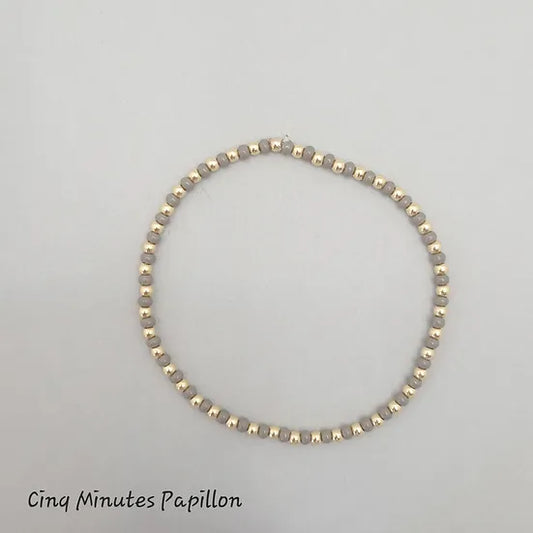 Bracelet en perles de rocaille et perles plaquées or